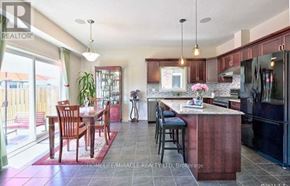 Niagara Falls (Oldfield) apartment for rent - A kitchen with a table and chairs in front of a window.