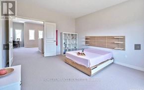 Niagara Falls (Oldfield) apartment for rent - A bedroom with a bed, a dresser, and a window with blinds.