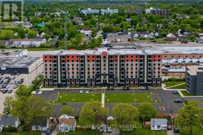 Welland (Lincoln/Crowland) multi-family for rent - An aerial view of a multi-story building with a parking lot in front.