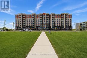 Welland (Lincoln/Crowland) multi-family for rent - A large apartment complex with a grassy area in front and a clear blue sky above.