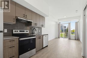 Burlington (Alton) condo for rent - A modern kitchen with a stove top oven and a dishwasher.