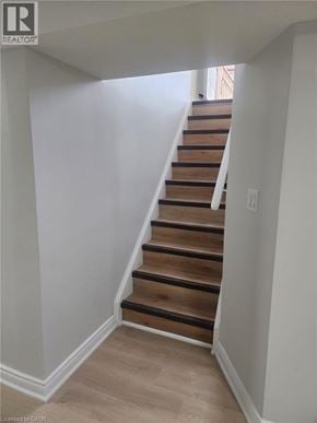 Kitchener apartment for rent - A staircase with wooden steps and white walls.