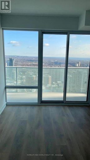 Toronto (Church-Yonge Corridor) condo for rent - A room with a view of the city through large windows.