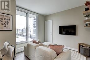 Toronto (Waterfront Communities) condo for rent - A living room with a sign that says "This must be the place".