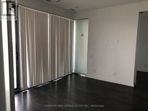 Toronto (Church-Yonge Corridor) condo for rent - A room with a sliding door and wooden flooring.