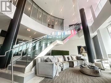 Richmond Hill (Observatory) condo for rent - A living room with a staircase and a couch.