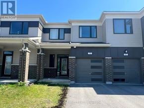 Ottawa townhouse for rent - A modern two-story house with a garage is shown.