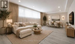 Ottawa apartment for rent - A well-lit, modern living room with a large sectional sofa, a coffee table, and a dining area.