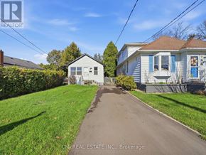 Hamilton (Glenview) apartment for rent - A residential street with houses on both sides and a clear blue sky above.