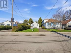 Hamilton (Glenview) apartment for rent - A street view with houses and a REALTOR sign.