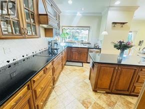 Vancouver apartment for rent - A kitchen with black countertops and wooden cabinets.