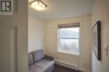 St. John’S apartment for rent - A living room with a grey couch and a window.