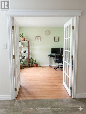 Whitby (Pringle Creek) apartment for rent - A room with a desk and a chair is visible through an open door.