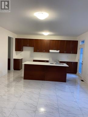 Newmarket (Glenway Estates) apartment for rent - A kitchen with brown cabinets and a white countertop.