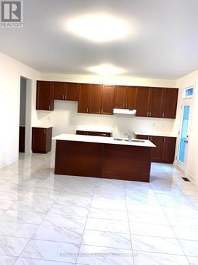 Newmarket (Glenway Estates) apartment for rent - A kitchen with white tiled floors and brown cabinets.