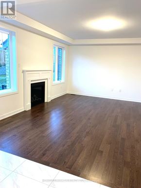 Newmarket (Glenway Estates) apartment for rent - A room with a fireplace and wood flooring.