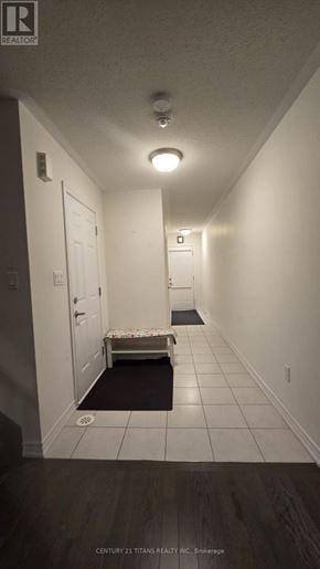 Whitby (Brooklin) townhouse for rent - A hallway with a bench and a door at the end.