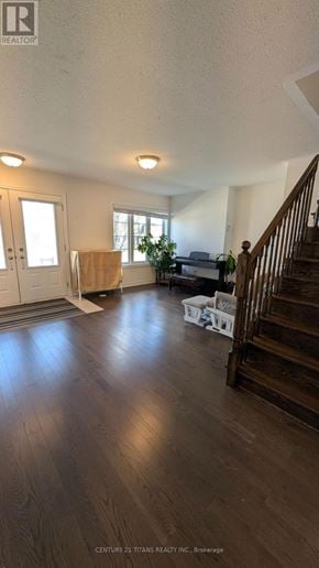Whitby (Brooklin) townhouse for rent - A living room with a staircase on the right side.