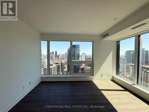 Toronto (Bay Street Corridor) condo for rent - A room with a view of the city skyline.