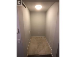Richmond apartment for rent - A hallway with a light on the ceiling and a sign on the wall.