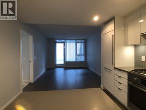 Richmond apartment for rent - A kitchen area with a stove, oven, and cabinets.
