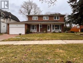Toronto (St. Andrew-Windfields) apartment for rent - A house with a white garage door is for sale.