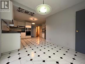 Toronto (St. Andrew-Windfields) apartment for rent - A spacious kitchen with black and white tiled flooring.
