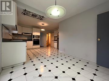 Toronto (St. Andrew-Windfields) apartment for rent - A spacious kitchen with black and white tiled flooring.