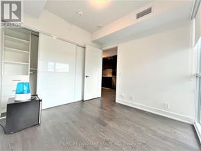 Toronto (Mount Pleasant West) condo for rent - A room with a white wall and a sliding door.
