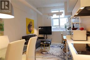 Toronto (Church-Yonge Corridor) condo for rent - A living room with a television, a sofa, a chair, and a coffee table.