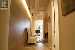 Toronto (Church-Yonge Corridor) condo for rent - A hallway with a light on the ceiling and a painting on the wall.