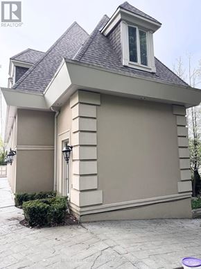 Toronto (Bridle Path-Sunnybrook-York Mills) apartment for rent - A house with a grey roof and a white window.