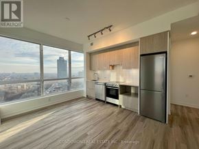 Toronto (Cabbagetown-South St. James Town) condo for rent - A kitchen with a view of the cityscape.