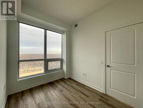 Toronto (Cabbagetown-South St. James Town) condo for rent - A room with a large window overlooking a cityscape.