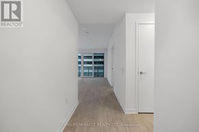 Toronto (Church-Yonge Corridor) condo for rent - A hallway with a door on the right and a window on the left.
