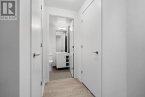 Toronto (Church-Yonge Corridor) condo for rent - A hallway with white walls and a white door.