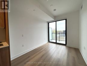 Toronto (Dovercourt-Wallace Emerson-Junction) condo for rent - A room with a sliding glass door leading to a balcony.