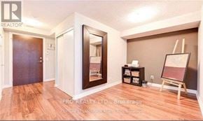 Toronto (Agincourt South-Malvern West) condo for rent - A room with a wooden floor and a white door.