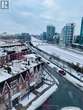 Toronto (South Parkdale) condo for rent - A view of a snowy city street from a high vantage point.