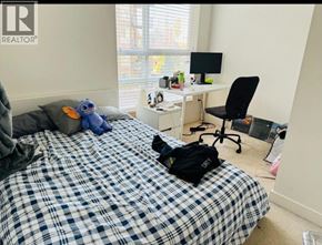 Vancouver apartment for rent - A bedroom with a bed, desk, chair, and window.