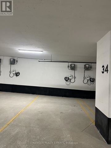 Toronto (Banbury-Don Mills) condo for rent - A parking garage with 34 marked on the wall.