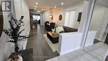 Brampton (Northwest Brampton) apartment for rent - A living room with a white couch and a wooden coffee table.