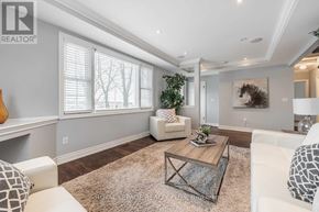 Hamilton (Waterdown) apartment for rent - A living room with a white couch and a coffee table.