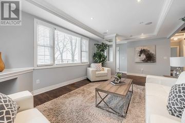 Hamilton (Waterdown) apartment for rent - A living room with a white couch and a coffee table.