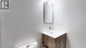Brampton (Northgate) multi-family for rent - A bathroom with a sink, mirror, and toilet.