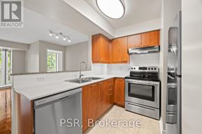 Toronto (Lawrence Park South) condo for rent - A kitchen with wooden cabinets and stainless steel appliances.