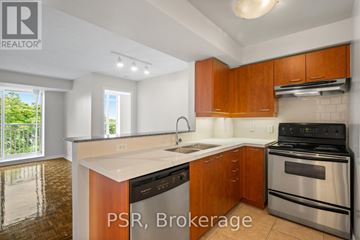 Toronto (Lawrence Park South) condo for rent - A kitchen with brown cabinets and stainless steel appliances.