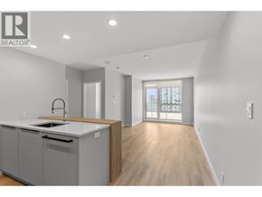 Coquitlam apartment for rent - A modern kitchen with a sink and a window.
