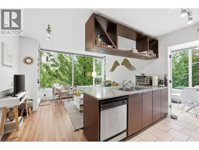 Vancouver apartment for rent - A modern kitchen with wooden floors and a large island.