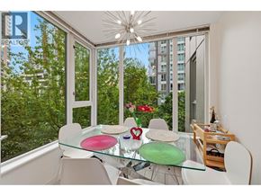 Vancouver apartment for rent - A dining room with a glass table and chairs.